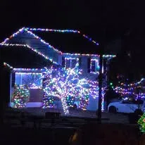 Bright residential Christmas lights at night
