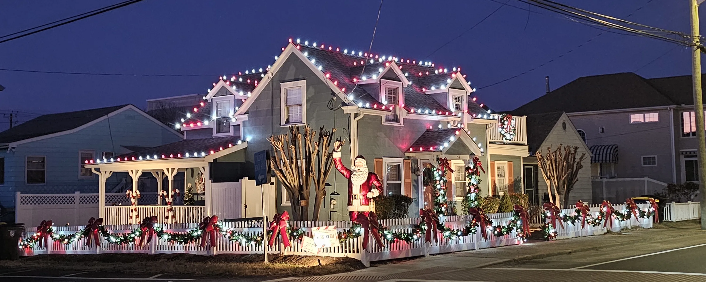 House lit up with Christmas lights in the evening